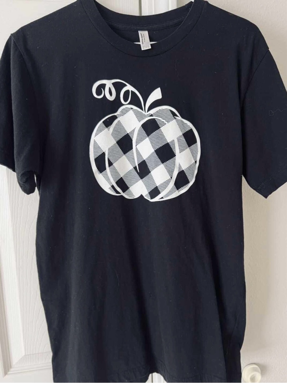 Women’s black T-Shirt with White Plaid Pumpkin Graphic